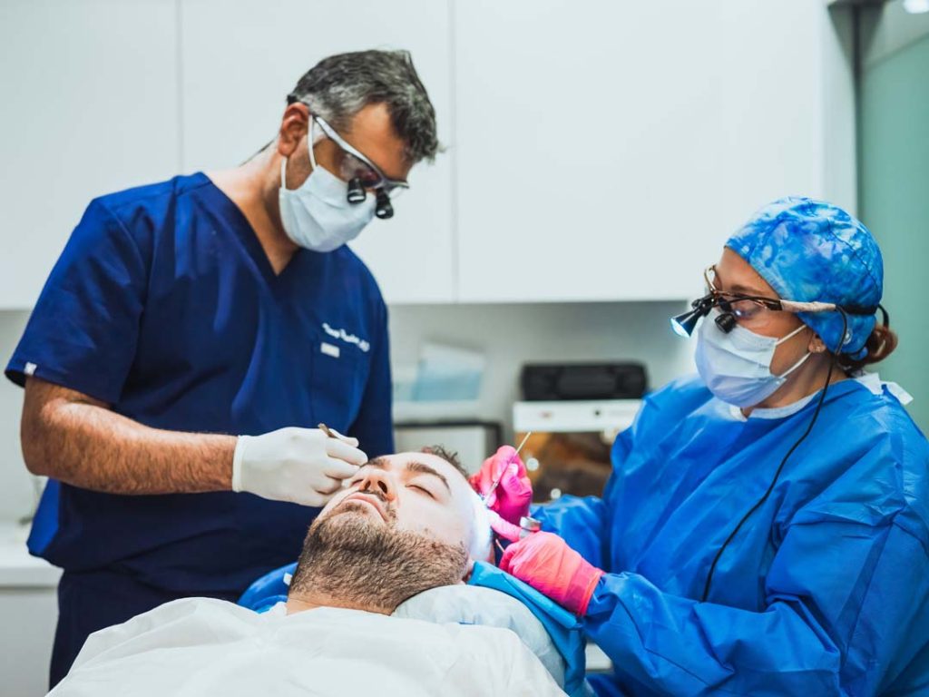 surgeons working on hair transplant